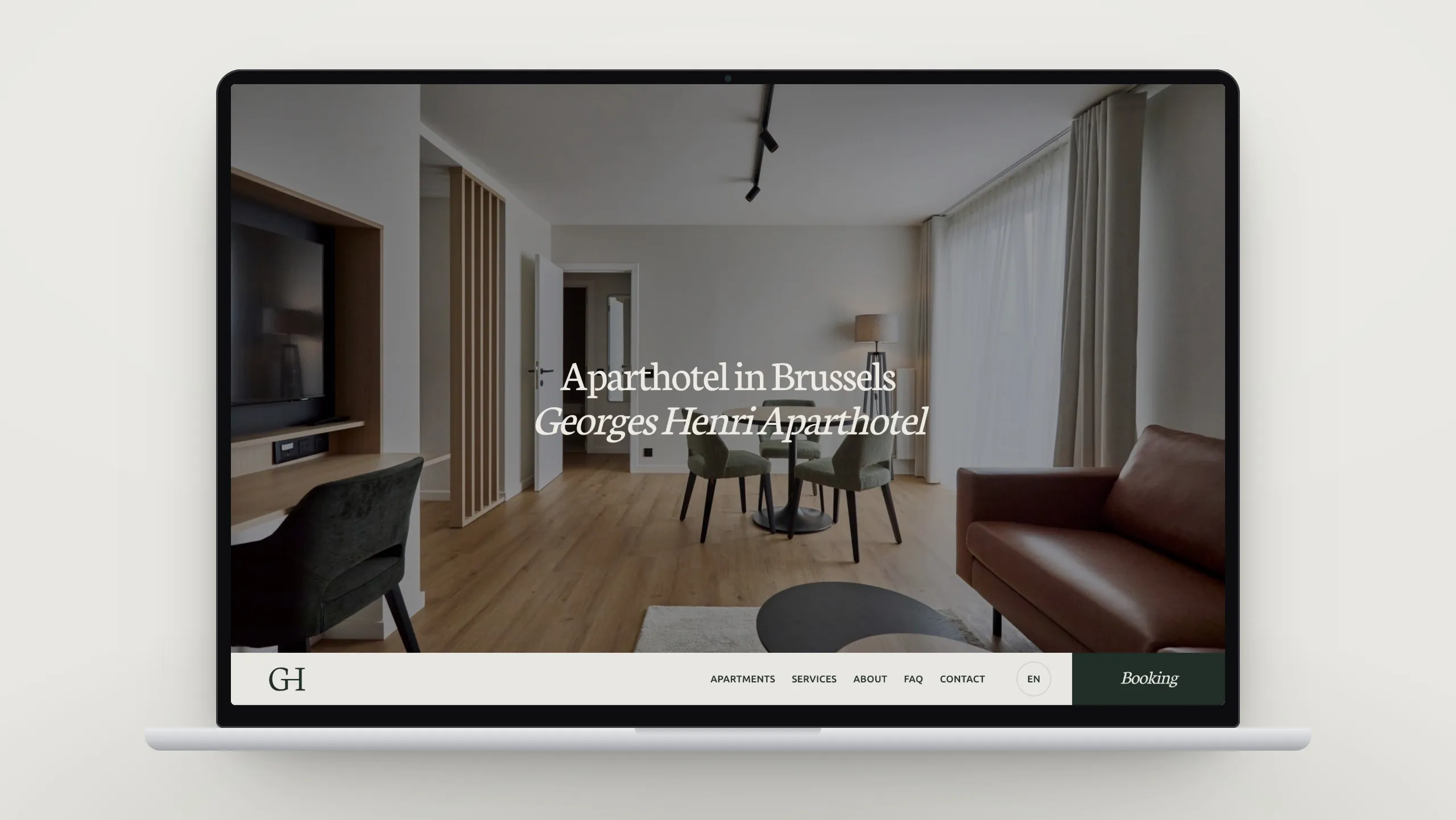 Le site de Georges Henri Aparthotel affiché sur un ordinateur portable